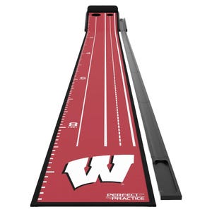 A red putting mat with the letter \“W,\“ marked with distance indicators in feet from 1 to 8, featuring two holes at one end and a ball return system.