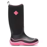A black waterproof boot with pink accents from Muck Boot Company, featuring a tall design and textured sole for enhanced grip and protection.
