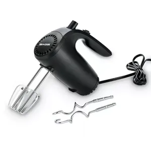 A black hand mixer with a pair of beaters attached and two dough hooks lying next to it.