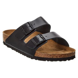 Black sandal with two adjustable straps and a cork footbed, featuring a textured rubber sole.