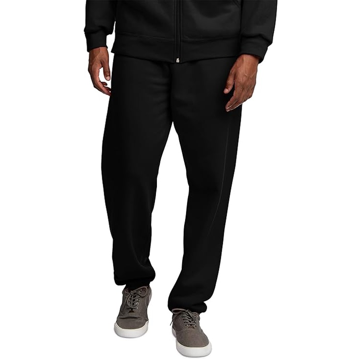 Black track pants paired with gray lace-up sneakers.