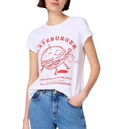 A person wears a white T-shirt featuring a red graphic of a smiling burger holding a drink, with the text \“Lateburger\“ and \“The Burger with the Smile.\“ Paired with blue jeans.