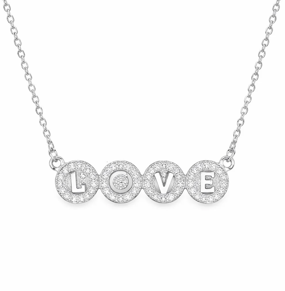 Silver necklace with circular pendants spelling \“LOVE\“ in capital letters, each embedded with sparkling stones.