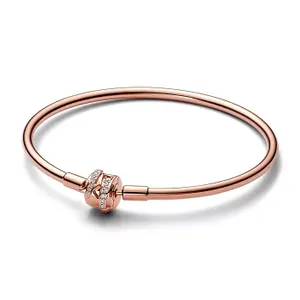 A sleek rose gold-plated bangle with a central bead encrusted with cubic zirconia, featuring a polished, minimalist design for an elegant look.