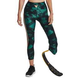 A person wearing green and black patterned leggings with a prosthetic running blade, paired with a black and white sneaker.