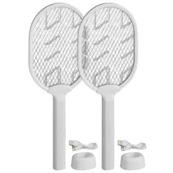 Two white electric fly swatters with charging bases and USB cables.