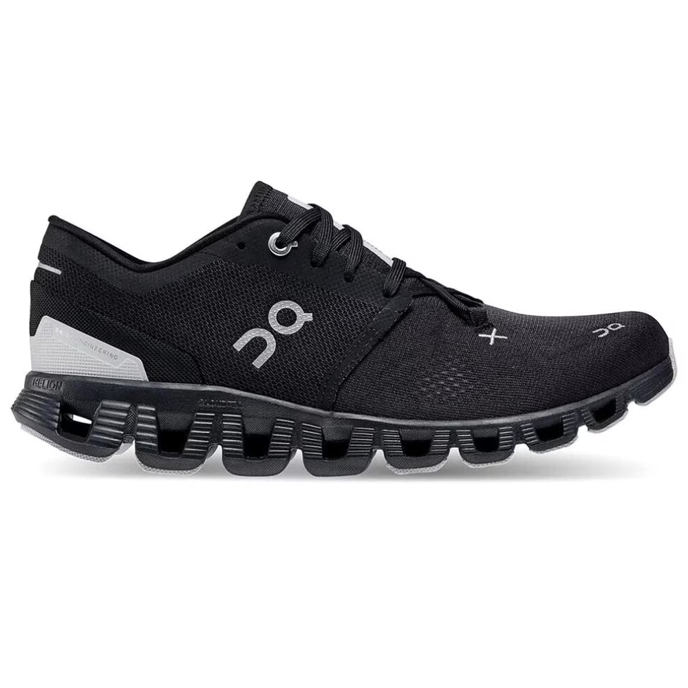 A black athletic shoe with a distinctive sole pattern and \“On\“ branding, designed for sports or running activities.