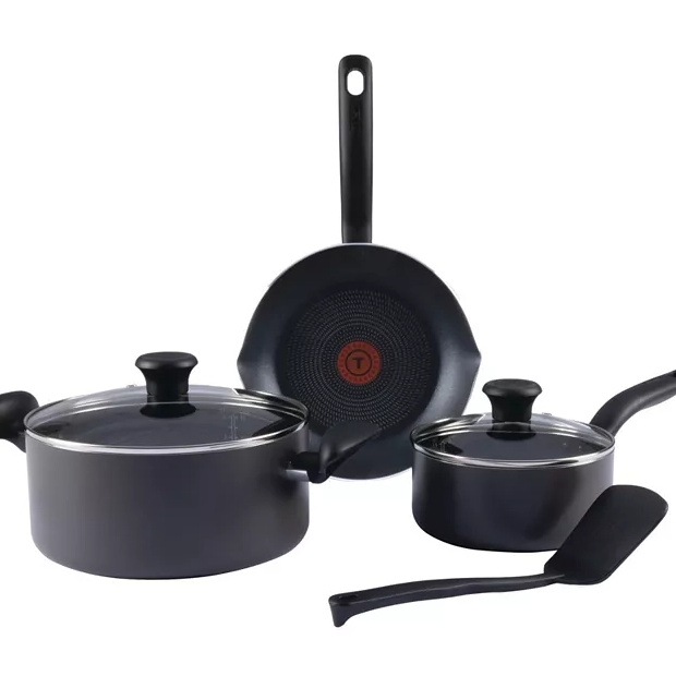 A non-stick cookware set including a frying pan, saucepan, and a cooking pot with lids, all featuring black handles. There's also a black spatula included.