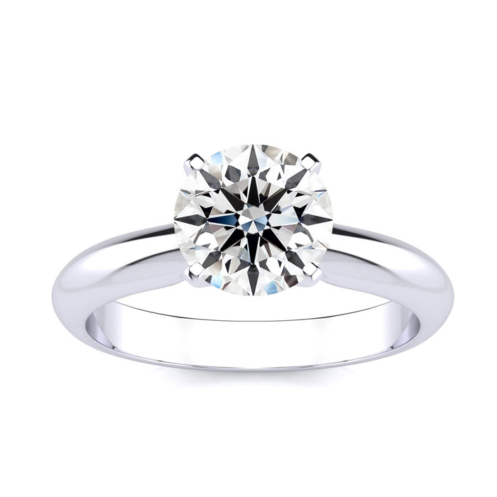 A polished white gold ring featuring a 1.5-carat round diamond in a classic four-prong setting, designed for a sleek and elegant look.