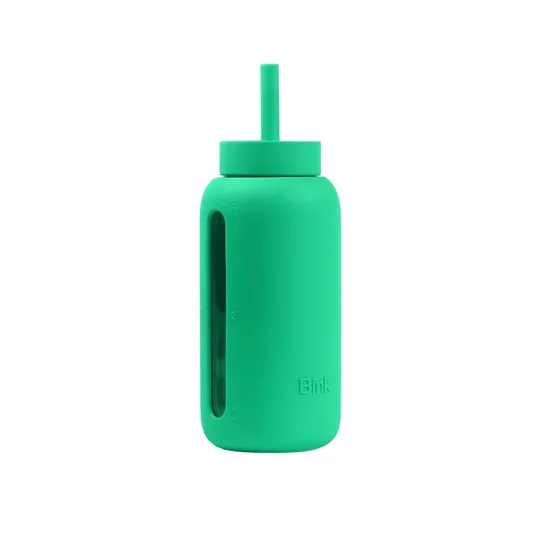Green silicone water bottle with a built-in straw and vertical window for measuring liquid levels.