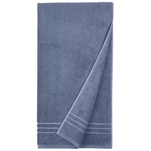 Dark blue bath towel with a subtle striped pattern at one end, designed for quick drying.