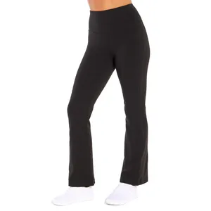 Black high-waisted, flared yoga pants with white athletic shoes.