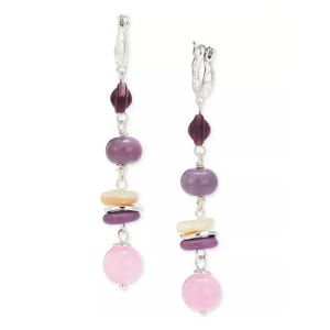A pair of dangle earrings featuring a mix of purple and pink beads of various shapes and sizes.