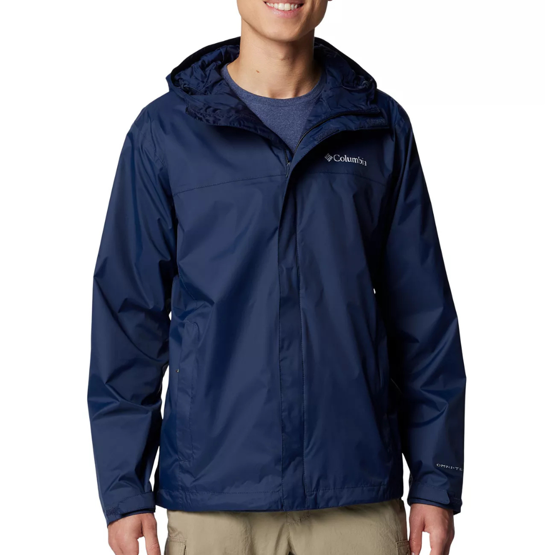 Man wearing a navy blue Columbia waterproof jacket with a hood and khaki pants.