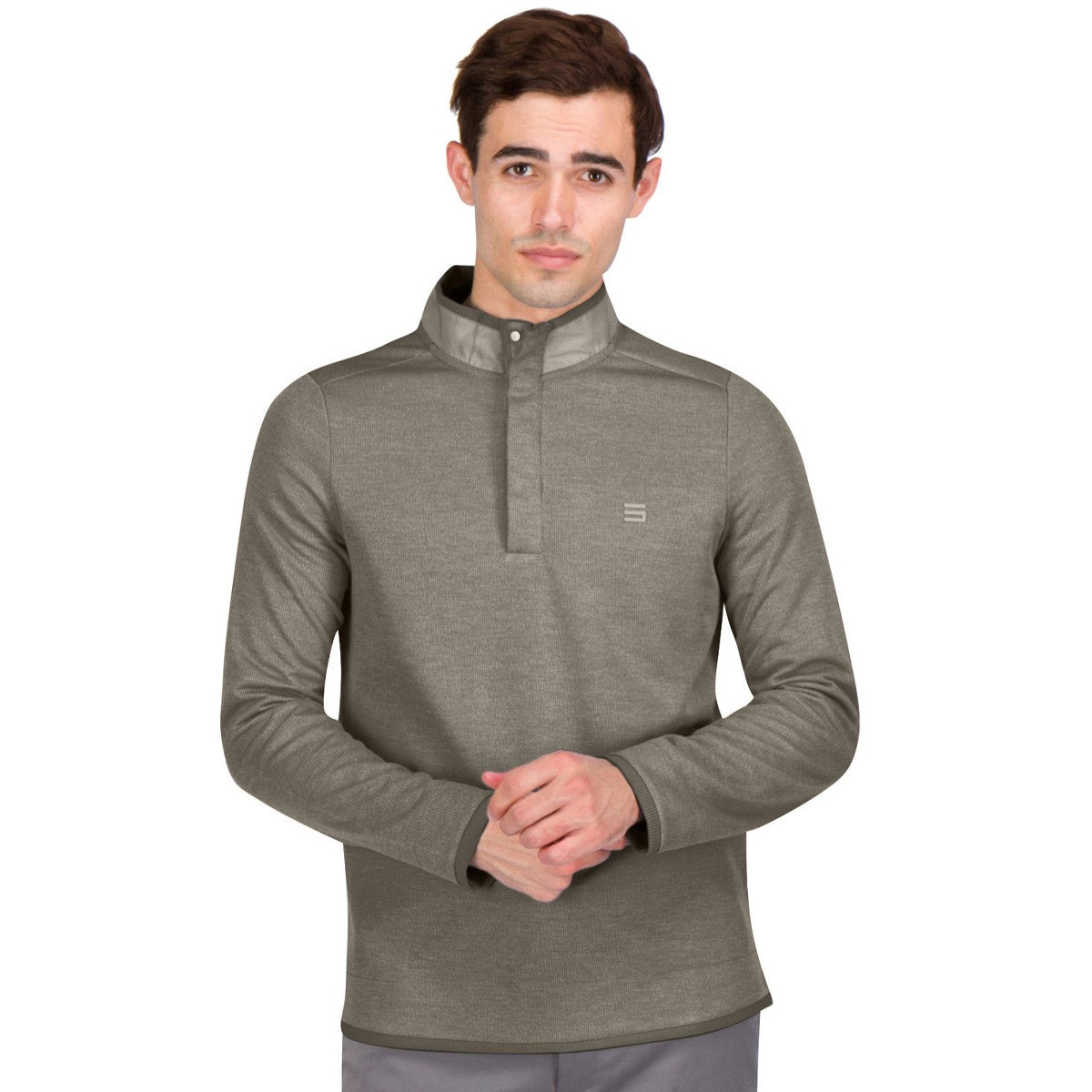 A man is wearing a long-sleeve, olive-green mock pullover with a short zipper collar and a small logo on the chest.