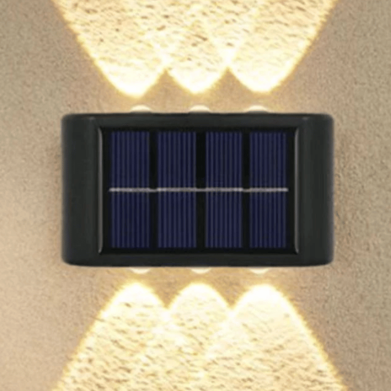 Wall-mounted solar-powered light with dual illumination to provide lighting above and below.
