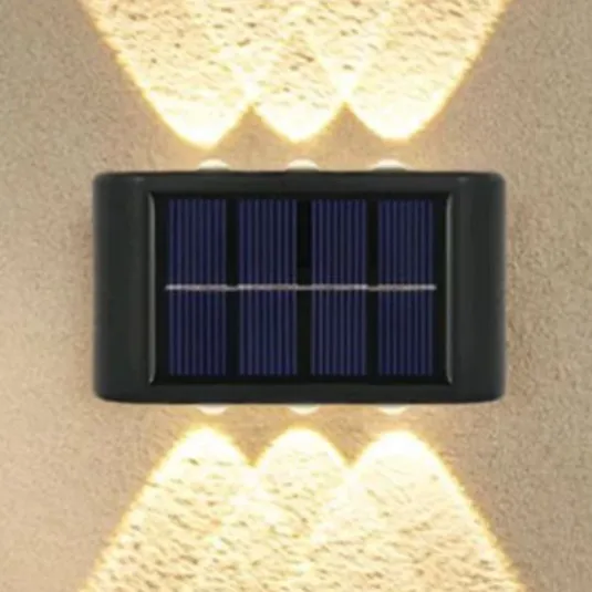 Wall-mounted solar-powered light with dual illumination to provide lighting above and below.