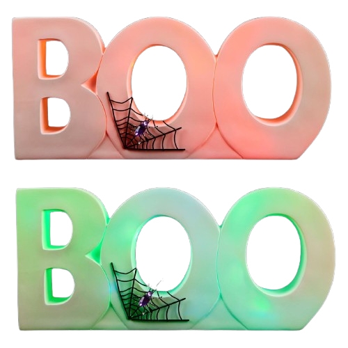 Two decorative signs spell \“BOO\“ with a spiderweb and spider detail, one lit in red-orange and the other in green-blue hues.