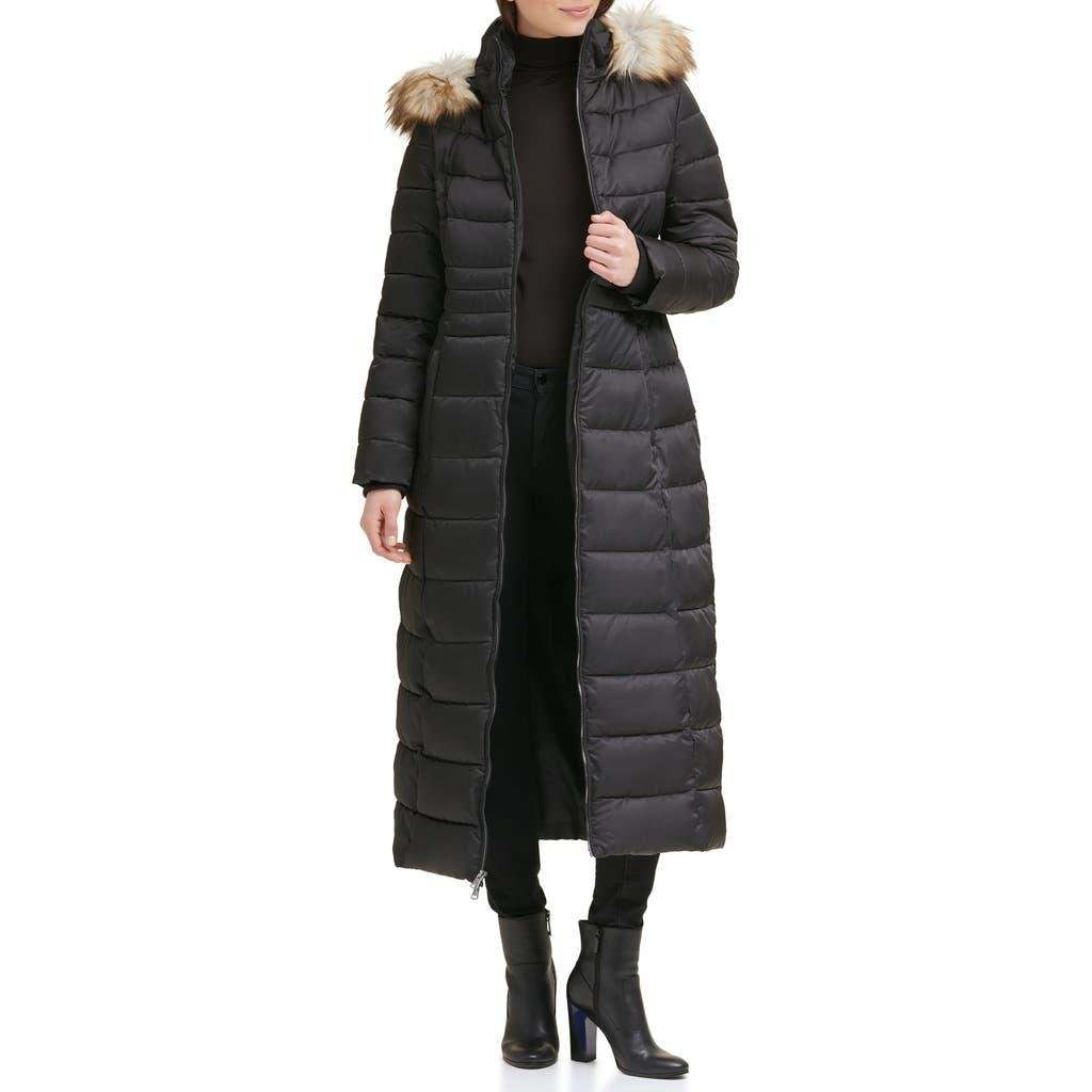 A long puffer coat with a fur-trimmed hood and front zipper, extending to the ankles in a quilted design, color black.