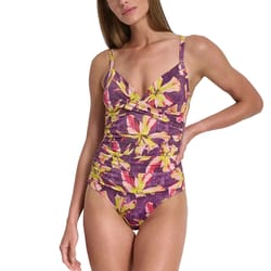 One-piece swimsuit with a purple background featuring a floral design in yellow and pink, adjustable straps, and a ruched front detail.
