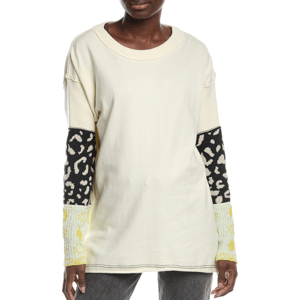 Free People Tiger Style Cuff Pullover is a long-sleeve, cream-colored top featuring mixed textile sleeves with black and beige animal print and yellow pattern cuffs, offering a unique, textured look.