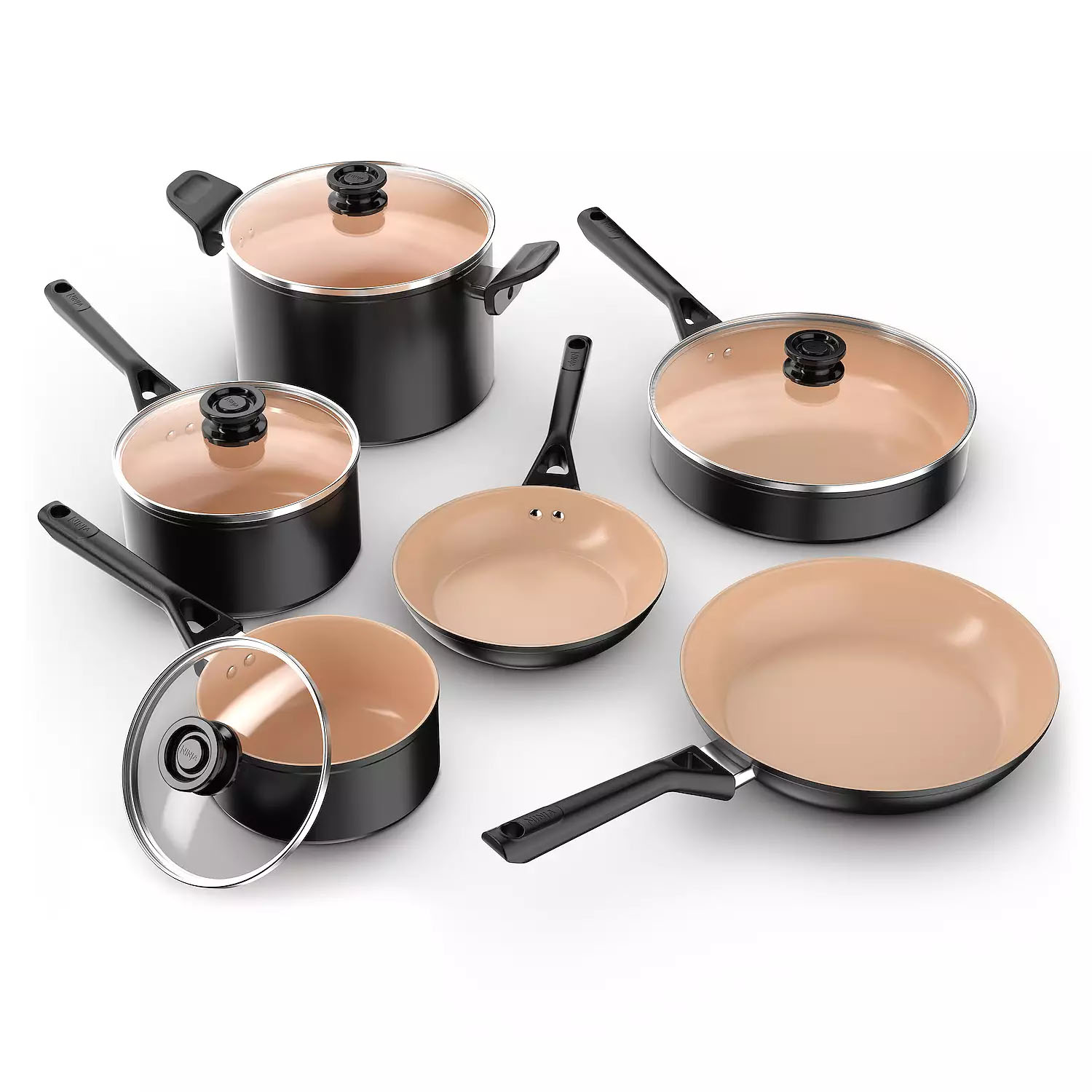 A set of black cookware with beige non-stick interiors, including pots, pans, and a skillet, some with glass lids.