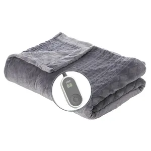 A gray electric blanket with a control device displaying temperature settings.