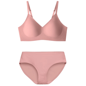 A light pink seamless bra and panty set with adjustable straps and smooth fabric for comfort and a minimalist appearance.