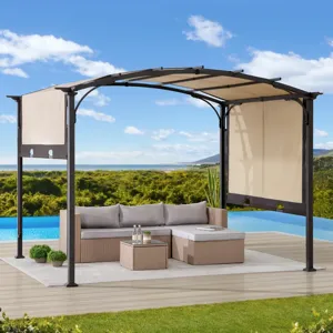Outdoor patio setup featuring a wicker sofa set, small table, and a canopy pergola with retractable beige curtains, overlooking a pool with a scenic view.
