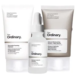 The photo shows three The Ordinary skincare items: a Glucoside Foaming Cleanser, a Salicylic Acid 2% Solution, and a Natural Moisturizing Factors + Beta Glucan.