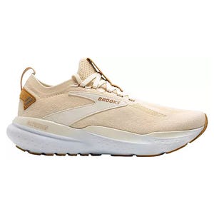 A light beige Brooks running shoe with a streamlined design, featuring a cushioned white sole and subtle branding on the side.