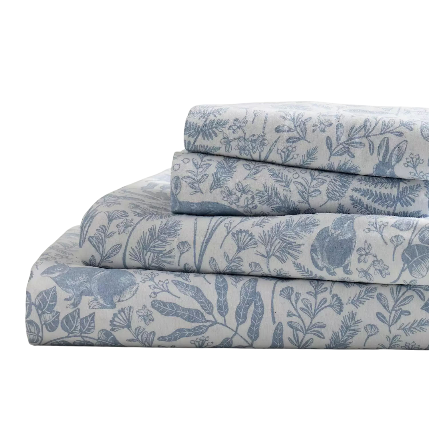 A stack of folded bedding with a floral and animal design in shades of blue and white, featuring leaves, flowers, and rabbits.