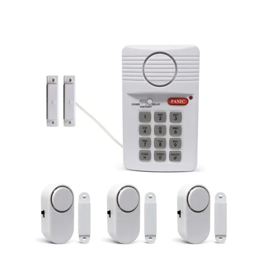 A home security system with a keypad, door sensors, and alarm units. The components include a keypad with a panic button and switch settings, and several wireless magnetic door/window alarm sensors.
