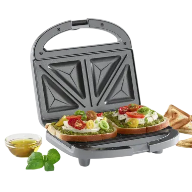 A sandwich maker is shown with two slices of bread topped with various ingredients, alongside a few toasted sandwiches and a small bowl of oil or dressing with basil leaves.
