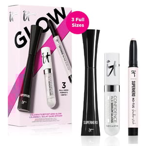 The 3-piece IT Cosmetics set includes full-size Superhero Mascara, Confidence in a Serum Gloss, and Superhero No-Tug Shadow Stick, designed to enhance eyes and lips with a focus on effortless glow.