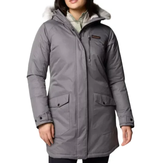 Gray Columbia Suttle Mountain Long Jacket featuring a hood with faux fur trim, two large front pockets with button flaps, and a zippered chest pocket. It is designed for warmth and comfort in cold weather.