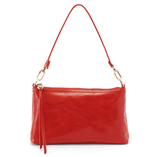 A red shoulder bag with gold hardware and a detachable strap.