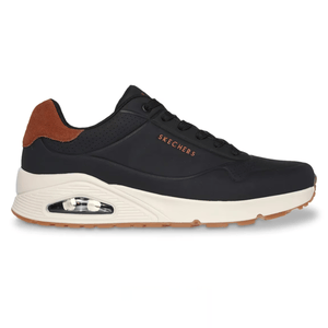 Black Skechers sneaker with a white sole and a visible air cushion. Features brown suede detailing on the heel and Skechers branding on the side.