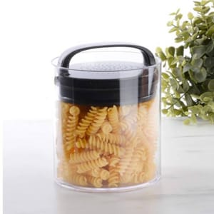 A transparent airtight food container with a black handle and lid, filled with uncooked fusilli pasta.