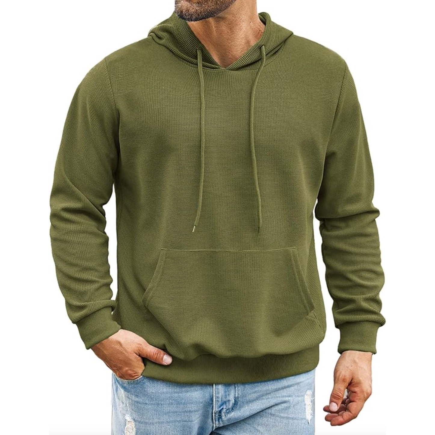 A green, long-sleeve hoodie with an adjustable drawstring hood, front kangaroo pocket, and ribbed cuffs and hem. It is paired with light blue, distressed jeans.