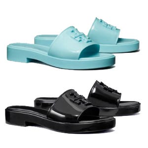 Two pairs of slip-on sandals, one in light blue and the other in black, both with a low heel and a single strap across the foot.
