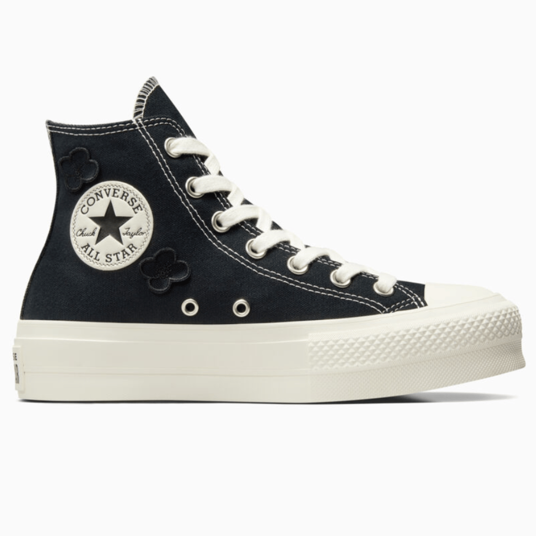 Black high-top sneaker with white laces, rubber toe cap, and platform sole.
