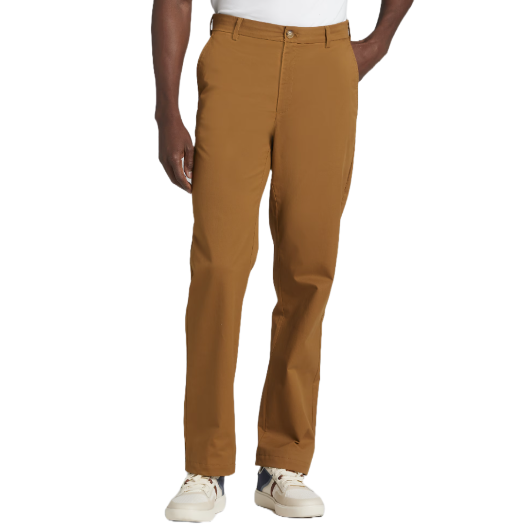 A person is wearing brown pants paired with white sneakers.