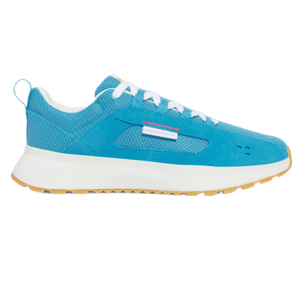 UA Men's Street Mirage Shoes feature a vibrant blue upper with mesh and suede accents, white laces, a cushioned white midsole, and a gum tread sole for traction. They are designed for a stylish and comfortable urban look.