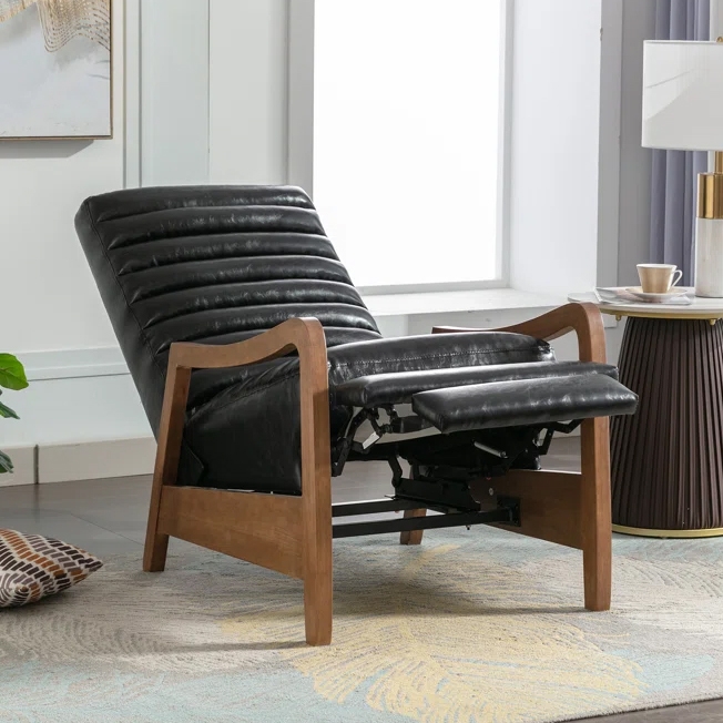 Mid-century modern recliner chair with wooden frame and black leather upholstery, shown in a contemporary living room setting.