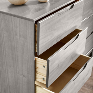 A gray wooden dresser with several open drawers, showcasing a sleek design and simple pull handles.