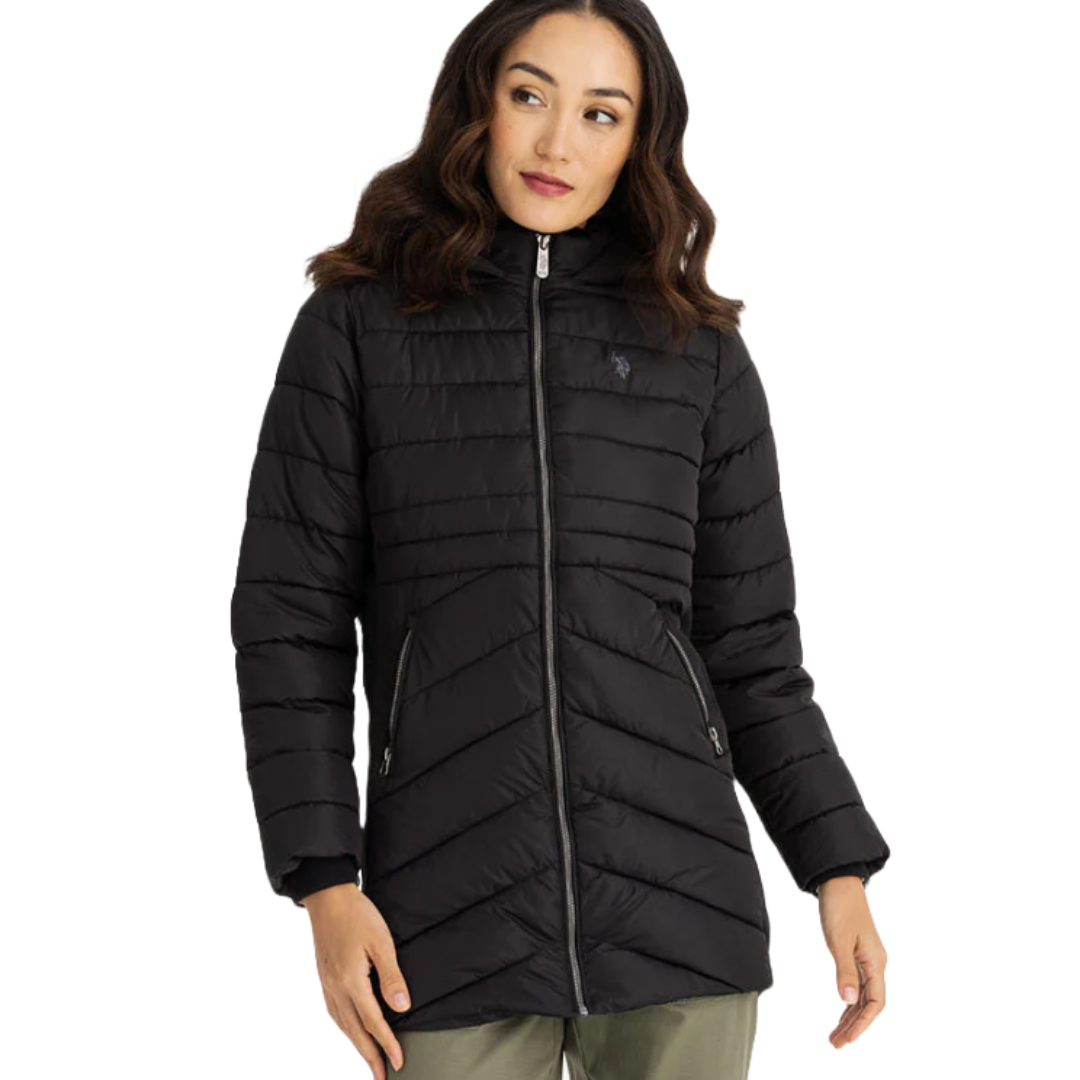 A black U.S. Polo Assn. Cozy Puffer Coat with horizontal quilting, a hood, front zipper closure, and two zippered pockets. Features a small embroidered logo on the chest.
