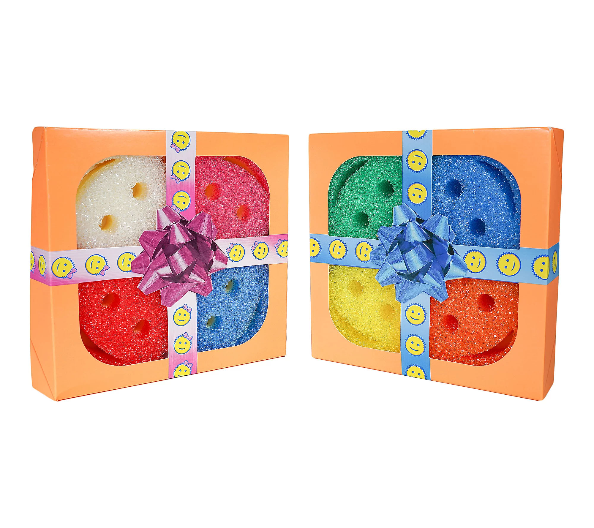 Two gift sets contain colorful smiley face sponges in orange boxes with a smiley-themed ribbon and a decorative bow. Each box displays four sponges in various colors: white, red, green, yellow, orange, and blue.