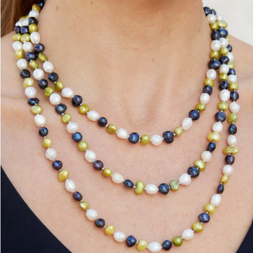 A necklace composed of three strands of mixed pearls in white, olive green, and dark blue is shown.