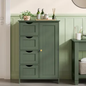 Green bathroom cabinet with three drawers and a door, featuring a potted plant, liquid bottles, and a reed diffuser on top.
